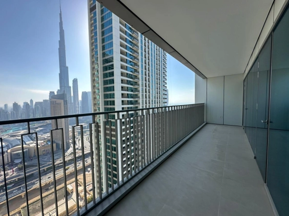 Exterior view of Downtown Views II, a modern apartment complex in Dubai, featuring sleek architectural design with glass facades, and an interior shot of a three-bedroom apartment with contemporary decor, large windows, and luxurious finishes.