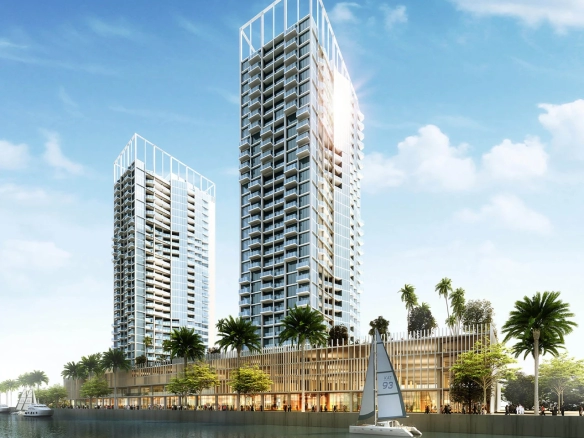 Modern studio apartment interior at Damac Maison Prive in Business Bay, Dubai, showing a well-equipped kitchenette, cozy sleeping area, and living space with large windows overlooking the city.