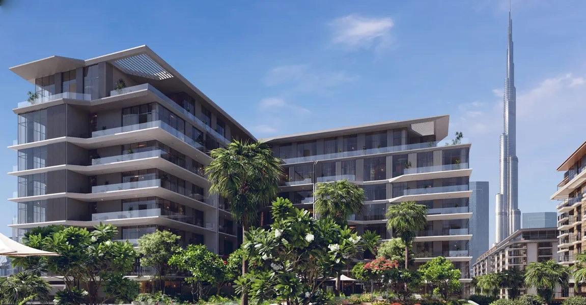 Verve Citywalk by Meraas exterior view featuring modern low-rise buildings, lush landscaped gardens, and a vibrant urban setting in Dubai.