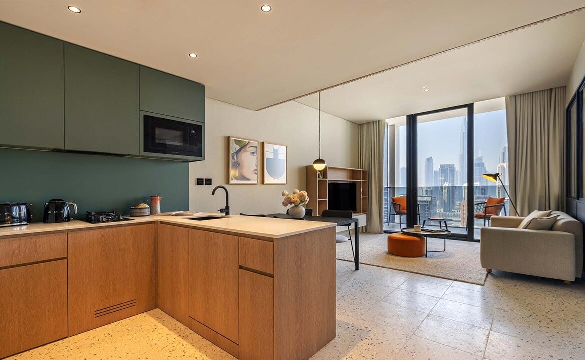 Living room of the studio for rent in Upside Living, Business Bay, with a stunning view of the Dubai skyline.